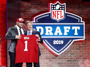 Nick Bosa of Ohio State with NFL commissioner Roger Goodell after being announced as the second pick in the first round of the NFL Draft by the San Francisco 49ers on April 25, 2019, in Nashville, Tenn.