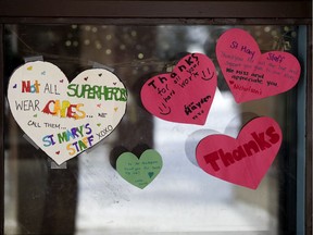 Students have decorated the front entrance to St. Mary Catholic School, 490 Rhatigan Road East NW, with paper hearts and messages to teachers and staff, in Edmonton Wednesday April 1, 2020.