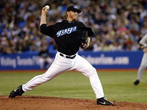 Late Toronto Blue Jays legend Roy Halladay throws a pitch during a 2005 game. A new book about Halladay has been released.