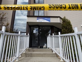 Police tape blocks the smashed front entrance to the Callingwood On 170th Apartments, 17004 64 Avenue, in Edmonton Thursday May 14, 2020. The Alberta Serious Incident Response Team (ASIRT) is investigating after a man sustained life-threatening injuries after he jumped or fell from a fourth floor balcony during an arrest by Edmonton police at the Callingwood On 170th Apartments. Photo by David Bloom