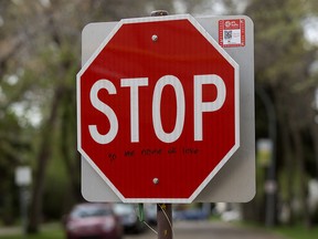 A stop sign alone 108a Street near 66 Avenue has been turned into song lyrics, in Edmonton Tuesday May 19, 2020. Photo by David Bloom