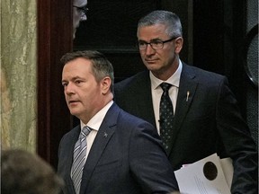 Alberta Premier Jason Kenney (left) and Travis Toews (right, Alberta Minister of Finance and President of the Treasury Board) enter the chamber at the Alberta Legislature in Edmonton where Toews delivered his provincial budget speech on Thursday February 27, 2020.