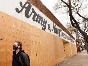Crews put up boarding around the Army and Navy Department Store, 10411 82 Ave., April 16, 2020. The company announced May 9, 2020 that all its stores would close permanently.