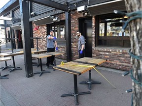 The staff at Hudsons pub on Whyte Avenue are preparing their patio on Wednesday, May 13, 2020, in preparation for the restriction to be eased on Thursday, May 14, 2020.