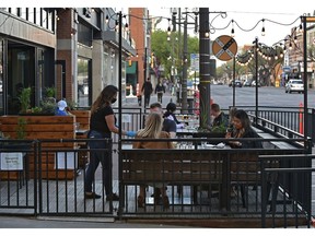 The patio at Malt and Mortar restaurant is open after the province relaxed patio rules during COVID-19, along Whyte Ave. in Edmonton, May 19, 2020.