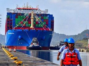 Chinese Cosco Shipping Rose container ship sails near the Cocoli locks, in the Panama Canal on Dec. 3, 2018.