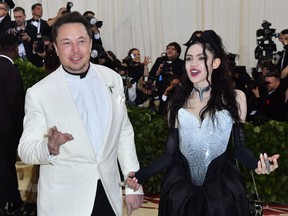 Elon Musk and Grimes arrive for the 2018 Met Gala at the Metropolitan Museum of Art in New York. Musk, the outspoken Tesla chief, announced the birth of the couple's first child, born May 4, before Grimes explained the child's unusual moniker.