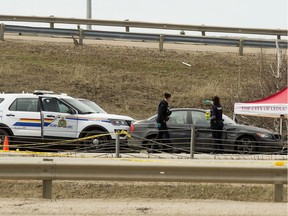 Police work at the scene of a shooting involving a police officer along the QEII just north of the Hwy 2A exit, in Leduc Wednesday May 6, 2020.