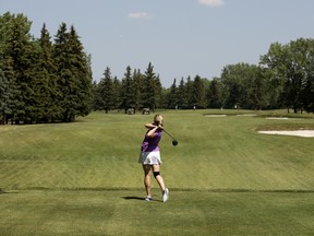 A golfer drives on the third hole at the Derrick Golf and Winter Club golf course in Edmonton on Thursday, July 9, 2015.