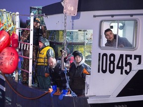 Fishing boats head from port in West Dover, N.S. on Tuesday, Nov. 26, 2019 as the lobster season on Nova Scotia's South Shore begins after a one-day weather delay. Ottawa is announcing $469 million in federal support for fish harvesters who have been ineligible for other initiatives during the COVID-19 pandemic.THE CANADIAN PRESS/Andrew Vaughan