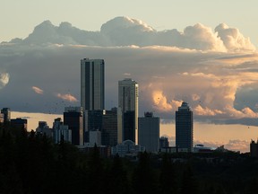 A flock of birds flies at sunset near downtown in Edmonton, on Wednesday, Oct. 3, 2020. Photo by Ian Kucerak/Postmedia