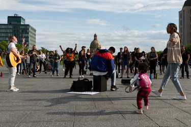 Demonstrators sing and dance on the Federal Building plaza during the A Fight for Equity rally at the Alberta Legislature in Edmonton, on Friday, June 5, 2020. Photo by Ian Kucerak/Postmedia