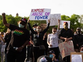 Demonstrators cheer during the A Fight for Equity rally at the Alberta Legislature in Edmonton, on Friday, June 5, 2020. The demonstration follows worldwide Black Lives Matter protests set off by the May 25 death of George Floyd in Minneapolis, Minnesota. Police officer Derek Chauvin has been charged with murder after Floyd died during an arrest where Chauvin knelt on his neck for nine minutes. Photo by Ian Kucerak/Postmedia