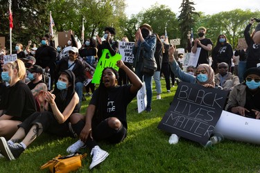 Demonstrators cheer during the A Fight for Equity rally at the Alberta Legislature in Edmonton, on Friday, June 5, 2020. The demonstration follows worldwide Black Lives Matter protests set off by the May 25 death of George Floyd in Minneapolis, Minnesota. Police officer Derek Chauvin has been charged with murder after Floyd died during an arrest where Chauvin knelt on his neck for nine minutes. Photo by Ian Kucerak/Postmedia