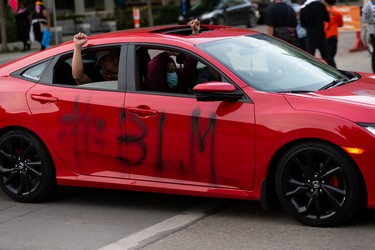 Demonstrators take to the streets during the A Fight for Equity rally at the Alberta Legislature in Edmonton, on Friday, June 5, 2020. Drivers honked their horns as demonstrators called out for equality and justice. Photo by Ian Kucerak/Postmedia