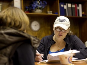 SNUG co-founder Kari Thomason does an intake meeting with a client during a SNUG operation in Edmonton. File photo.