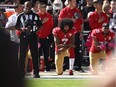Colin Kaepernick (7) of the San Francisco 49ers kneels in protest during the national anthem prior to their NFL game against the Tampa Bay Buccaneers at Levi's Stadium on October 23, 2016 in Santa Clara, California.