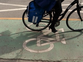 A cyclist travels along the divided bike lane on 99 Avenue near 106 Street in Edmonton, on Monday, May 6, 2019.