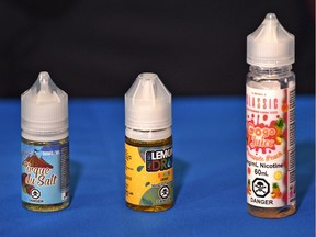 A few of the flavoured nicotine vaping liquids that are illegal to teens under 18. File photo.