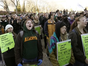 Hundreds of students from the University of Alberta and MacEwan University rallied on the front steps of the Alberta Legislature on Monday Nov. 18, 2019 to protest the provincial government's budget cuts to post-secondary education.