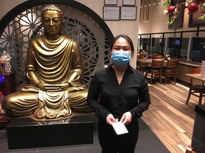 A server at Mai Vietnamese Fusion Restaurant at West Edmonton Mall waits for customers.