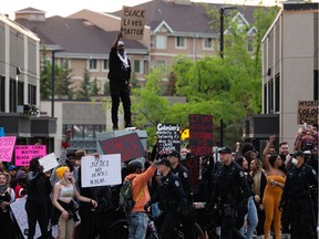 Demonstrators protest at 109 Street at Jasper Avenue after leaving the A Fight for Equity rally at the Alberta Legislature in Edmonton, on Friday, June 5, 2020.