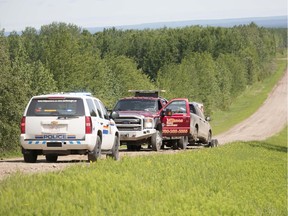 A vehicle was towed Tuesday morning after it was found in a ditch near Blue Ridge, Alta. with an unconscious man in the passenger seat. When the man regained consciousness he fled into the bushes on foot. RCMP are looking for Bradley Duff who has warrants for his arrest which were issued by the Correctional Service of Canada for violating his parole.  Photo by Brigette Moore  WHITECOURT STAR - MAYERTHORPE FREELANCER