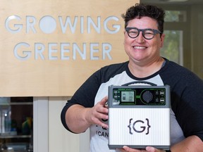 CANIE Digital award winner Connie Stacey, CEO of Growing Greener Innovations, is seen at the company's office in Edmonton, on Thursday, June 11, 2020 with their GRENGINE UltraLite portable power system. Photo by Ian Kucerak/Postmedia