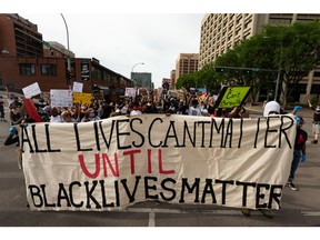 Demonstrators speak out against police brutality against Black people in Canada and worldwide during the Silence the Sirens march in Edmonton, on Friday, June 12, 2020. Photo by Ian Kucerak/Postmedia