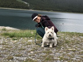 Tracy Li poses with her dog Malachi
