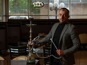 Khaldoun Hakima, owner of Mazati Mediterranean Cuisine at 16745 91 Street, poses for a photo with a hookah at the restaurant in Edmonton, on Saturday, June 13, 2020. Edmonton's ban on shisha and hookah lounges and the impact of the COVID-19 pandemic has severely impacted shisha lounges. Photo by Ian Kucerak/Postmedia