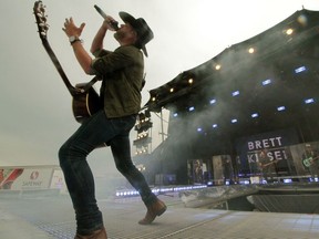 Edmonton country singer Brett Kissel plays one of eight sold-out concerts in light rain in the parking lot of River Cree Casino.