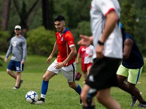 Soccer players play on a sunny day at Kinsmen Park in Edmonton, on Sunday, June 14, 2020. Photo by Ian Kucerak/Postmedia