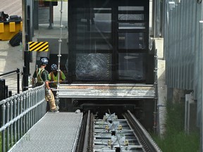 Workers begin repairs on the 100 Street funicular where all but one of the panes of glass were smashed during an act of vandalism which closed the attraction for repairs on Tuesday, June 23, 2020, about a week after it was opened .