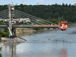 Almost there, as a boat passes underneath the new Tawatinâ Bridge across North Saskatchewan River on the Valley Line LRT in Edmonton, June 23, 2020. Ed Kaiser/Postmedia