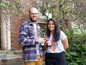 Nathan Marculis and his wife, Wafa Veljee, owners of Irrational Brewing Company, celebrate the start of the redevelopment of Edmonton's old Street Railway Substation No. 600 on June 30, 2020.