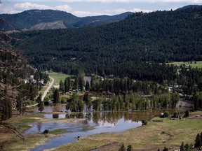 CP-Web. Flooded land is seen after the Kettle River overflowed its banks in Rock Creek, B.C., on Sunday May 13, 2018. The neighbouring Regional District of Central Kootenay issued an evacuation alert for all of its communities except for the cities of Castlegar and Nelson late Saturday evening.