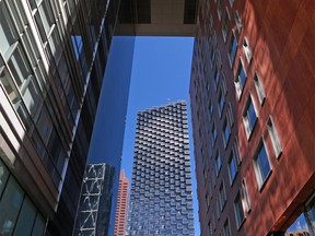 The Telus Sky building is framed with the St. Germain building in downtown Calgary on Thursday, June 11, 2020.