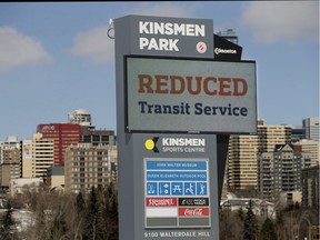 A sign at the Kinsmen Sports Centre notifies residents that City of Edmonton transit services have been reduced due to the COVID-19 pandemic.