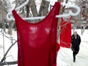 Red dresses, to honour missing and murdered indigenous women, hang from trees in the University of Alberta quad, in Edmonton Thursday Feb. 13, 2020.