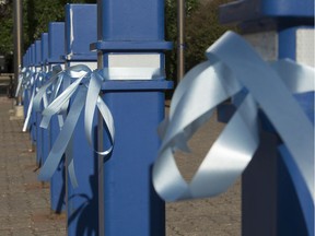 Blue ribbons were placed around Edmonton Police Service headquarters on Thursday, June 25, 2020. A spokesperson said they were placed on the building as a show of support and to mark the 30th anniversary of the murder of Const. Ezio Faraone.
