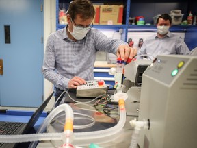 An Exergy Solutions team member tests one of 200 ventilators being donated to Alberta Health Services on Friday, June 5, 2020.