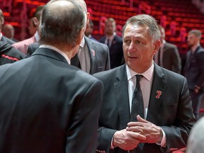 Detroit Red Wings GM Ken Holland talks to the Lindsay family during the public visitation of Ted Lindsay at Little Caesars Arena on March 8, 2019 in Detroit.