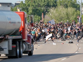 A tanker truck drives into thousands of protesters marching on 35W north bound highway during a protest against the death in Minneapolis police custody of George Floyd, in Minneapolis, Minnesota, U.S. May 31, 2020.