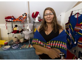Tina Goulet-Brett with some of her work at the Downtown Farmers Market during Indigenous Peoples Day on June 21, 2020.
