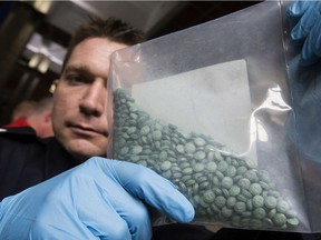 Sgt. Steve Sharpe displays some the drug fentanyl seized by the EPS drug and gang enforcement  unit following several recent investigations in Edmonton on May 1, 2015.