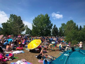 A viral photo from Saturday, July 11 shows a crowded beach at Sylvan Lake. The Twitter user @papercandie, an Edmonton mother who posted the photo said, 'My anxiety was a tad high today. Don't think we'll be going back. I felt like a Covidiot today.'
