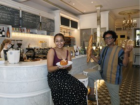 Owner Abel Shiferaw (right) and his daughter, Iza Shiferaw, display the wares at Eleanor et Laurent.