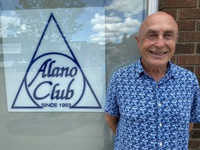 PJ Perry, posing in front of the Alano Club building, says it is a time in his life to give back to the community.