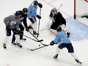 Philip Broberg, left, Leon Draisaitl (29) Gaetan Haas (91), goalie Mikko Koskinen (19), and Patrick Russell (52) take part in the first day of the Edmonton Oilers training camp for the 2019-20 NHL return to play at Rogers Place in Edmonton on Monday July 13, 2020.